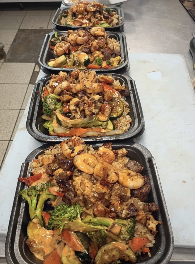 Row of fresh hibachi plates cooked to order